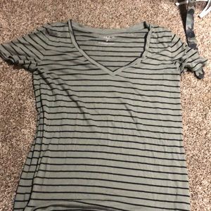 A green T-shirt with black lines